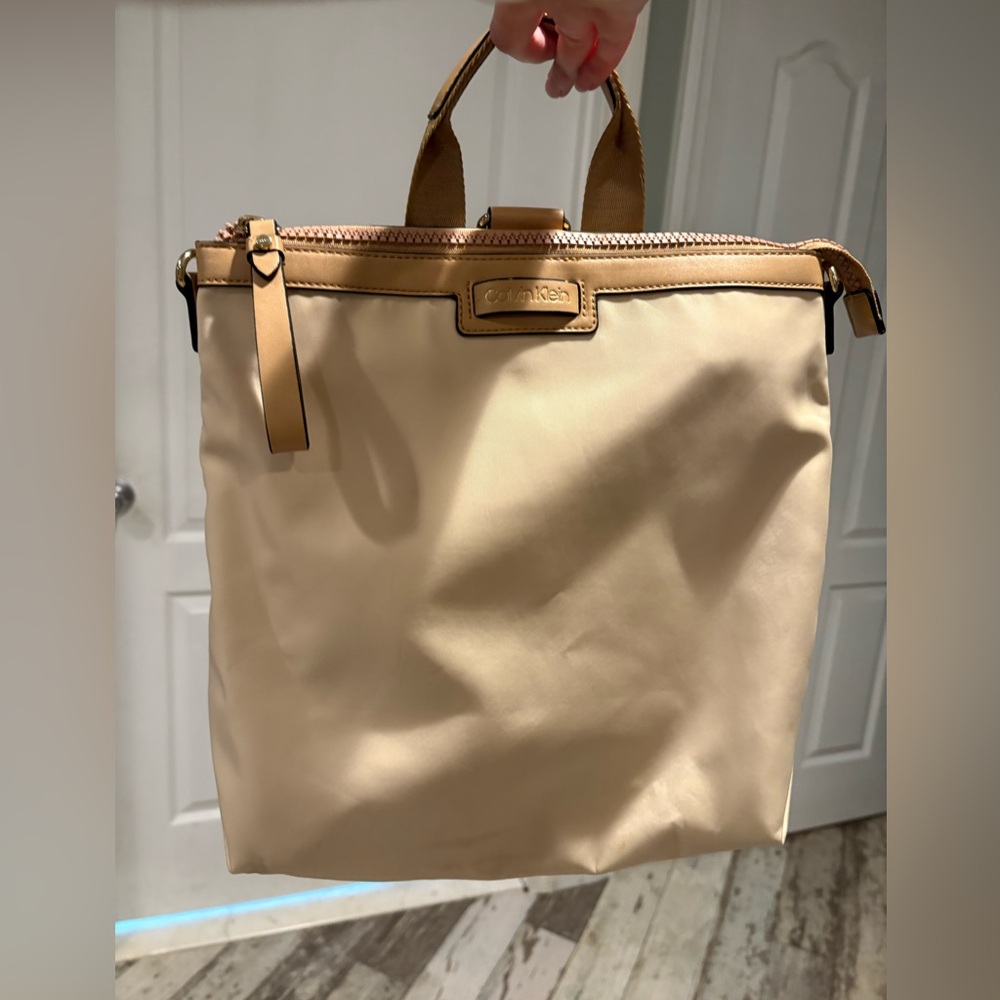 Calvin Klein cream and gold Tote/ backpack.